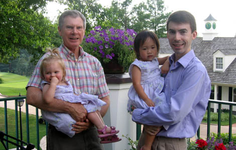 Grandpa and Daddy holding their little girls